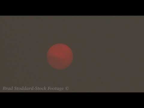 NM062 Fiery Red Sun Moves Thru Smoke Filled Sky