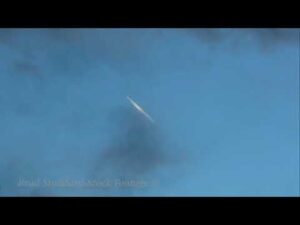 NM137 Jet Contrail In Clouds time-lapse 4k 24p